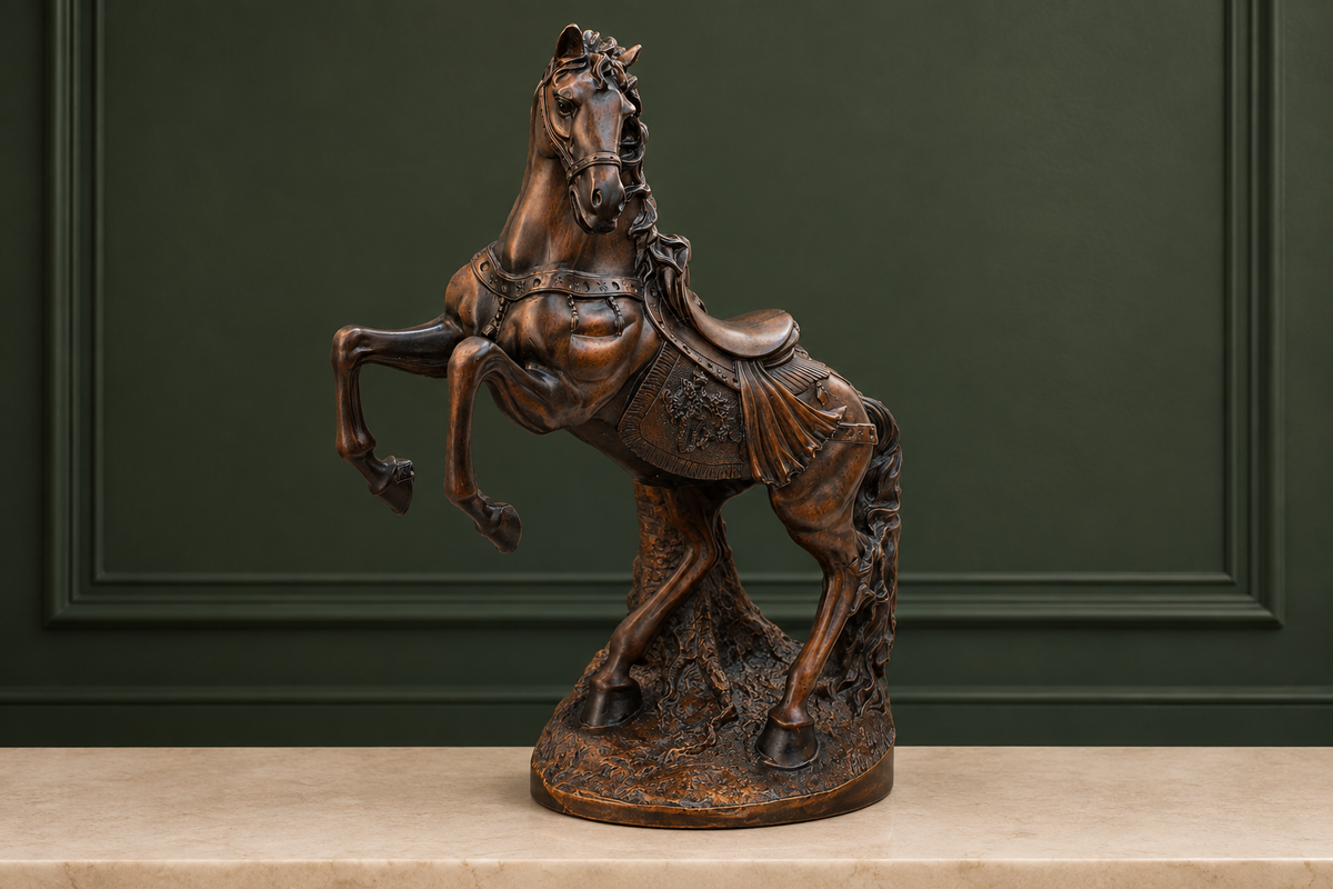Antique bronze rearing stallion statue displayed against a deep forest-green background