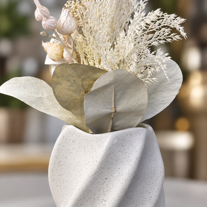 Close-up of vase texture and dried floral stems
