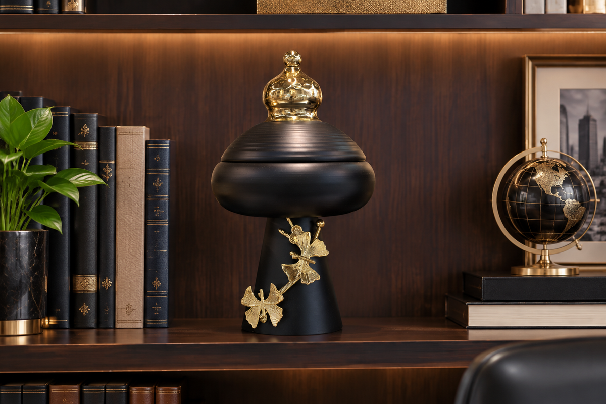 Black urn jar on office shelf