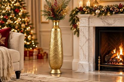 Gold floor vase next to marble fireplace