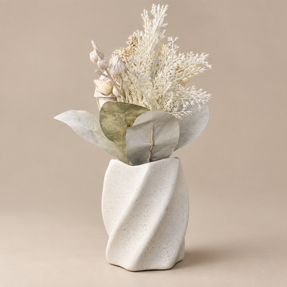 Minimalist white speckled twist vase, three-quarter angle