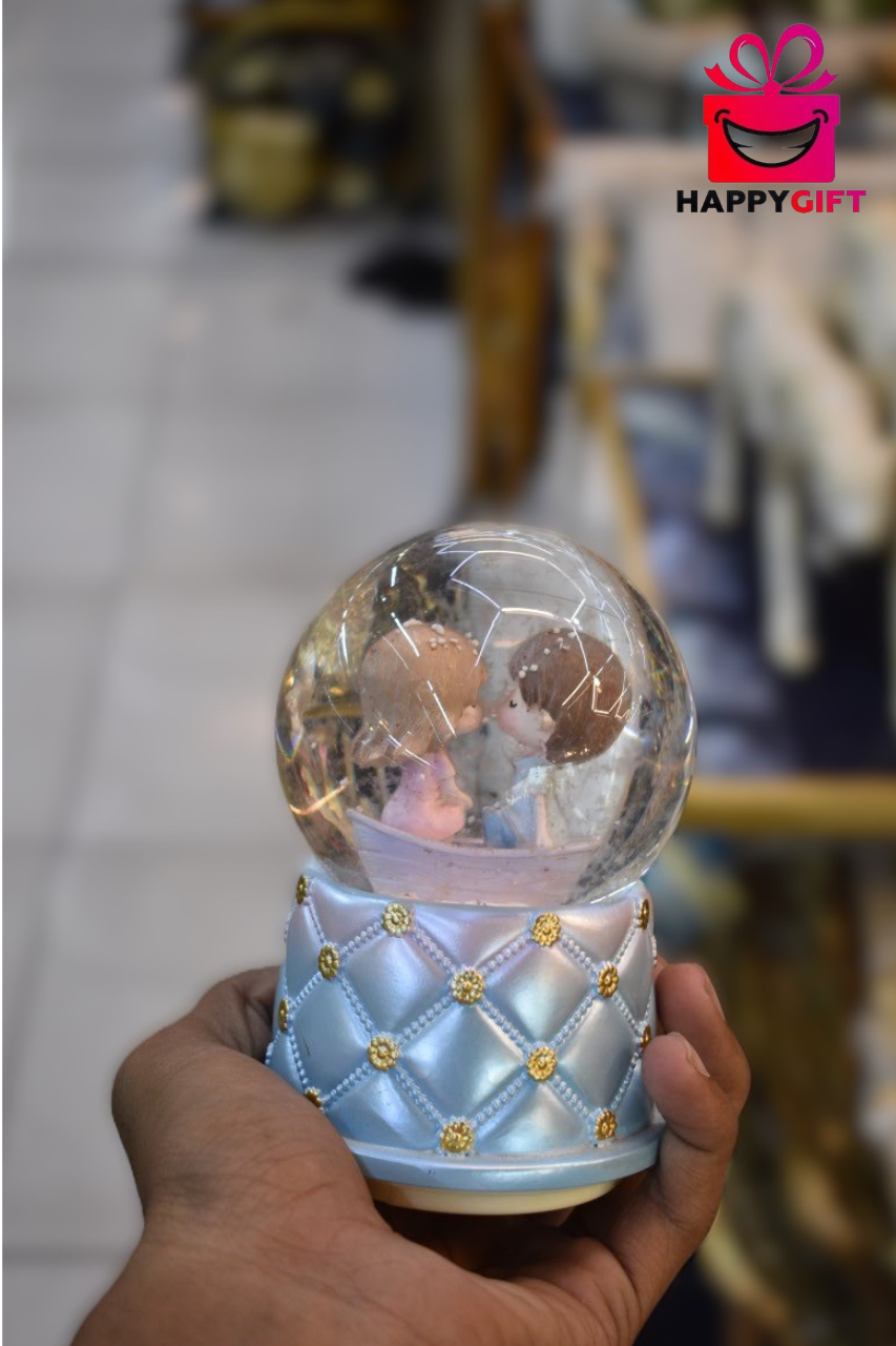 Romantic Couple in Boat Glass Snow Globe – Pastel Blue Tufted Base Decor